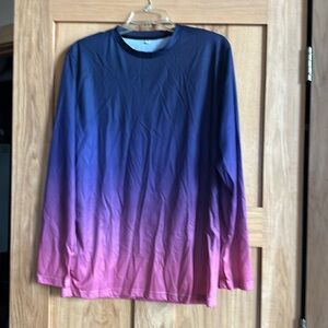 Women’s long sleeve top.  Dry fit type material 
Never worn